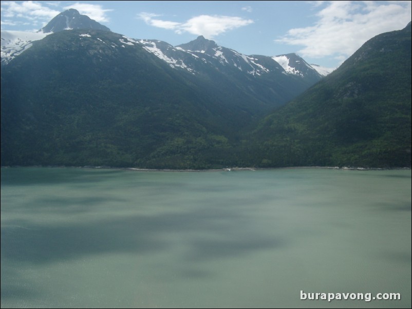 Views of the mountains, snow, icefields, etc. from inside the helicopter. Skagway.