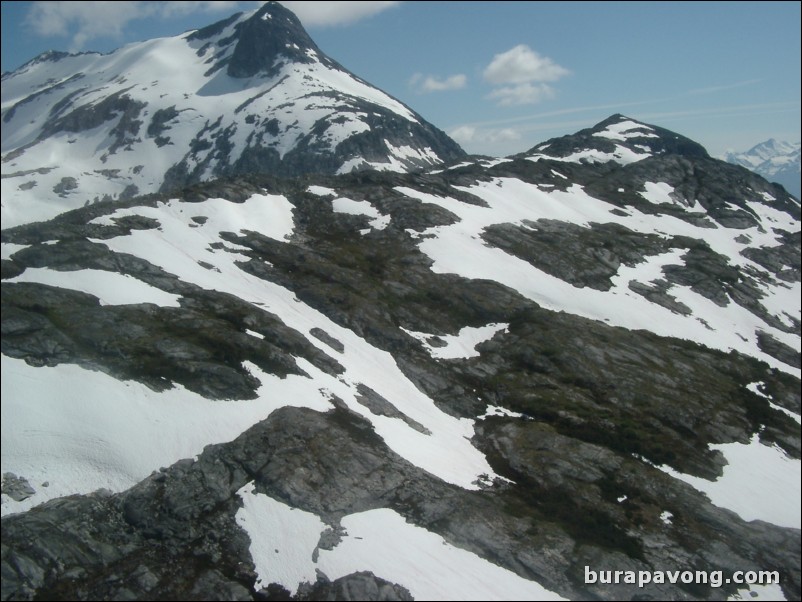 Views of the mountains, snow, icefields, etc. from inside the helicopter. Skagway.