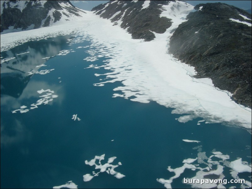 View of some deep blue water from inside the helicopter. Skagway.