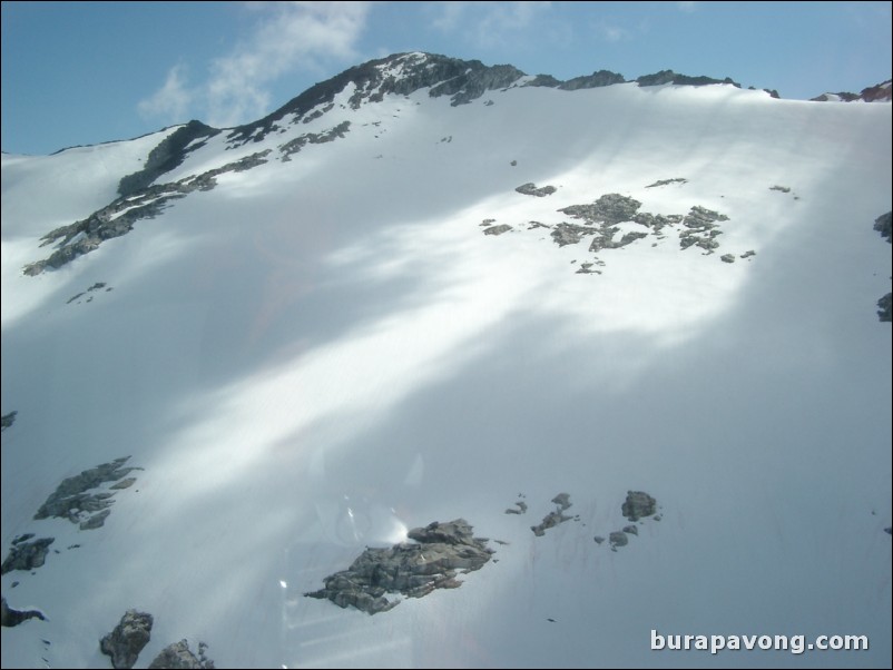 Views of the mountains, snow, icefields, etc. from inside the helicopter. Skagway.