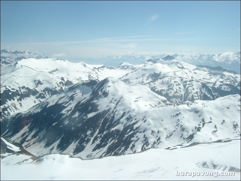 Views of the mountains, snow, icefields, etc. from inside the helicopter. Skagway.