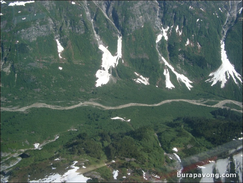 Views of the mountains, snow, icefields, etc. from inside the helicopter. Skagway.