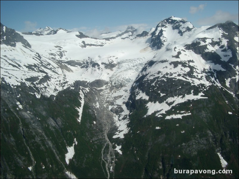 Views of the mountains, snow, icefields, etc. from inside the helicopter. Skagway.