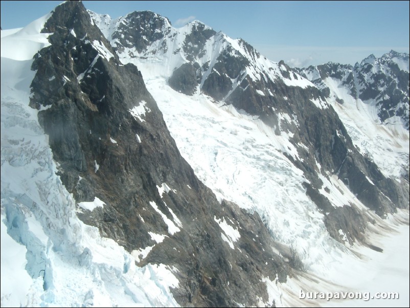 Views of the mountains, snow, icefields, etc. from inside the helicopter. Skagway.