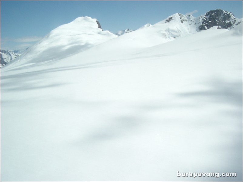 Views of the mountains, snow, icefields, etc. from inside the helicopter. Skagway.