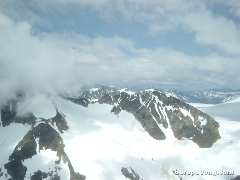 Views of the mountains, snow, icefields, etc. from inside the helicopter. Skagway.