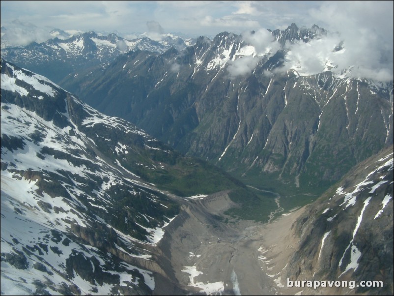 Views of the mountains, snow, icefields, etc. from inside the helicopter. Skagway.