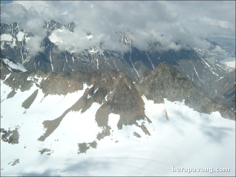 Views of the mountains, snow, icefields, etc. from inside the helicopter. Skagway.