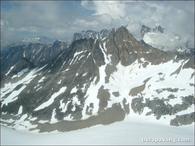 Views of the mountains, snow, icefields, etc. from inside the helicopter. Skagway.