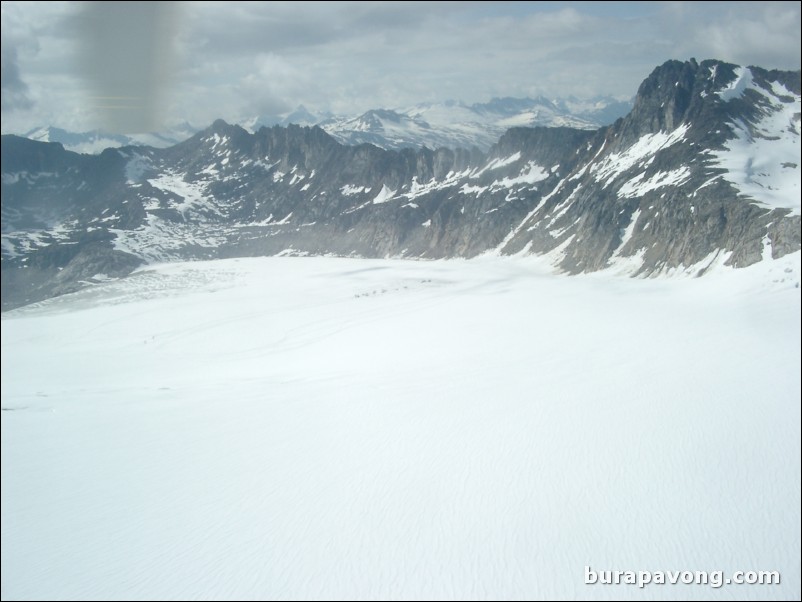 Views of the mountains, snow, icefields, etc. from inside the helicopter. Skagway.