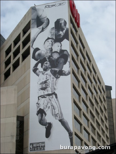 Steve Francis and other players in a Reebok advertisement on the CNN building.