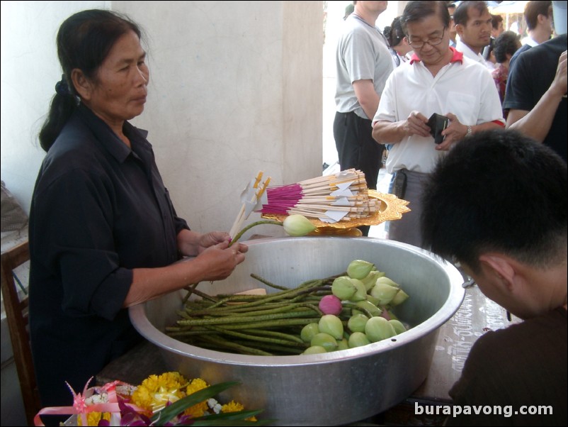 Woman selling incense and lotus, Wat Phra Mongkol Bophit.