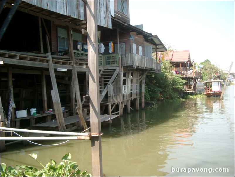 Houses along the Chao Phraya river, taken from the floating restaurant.