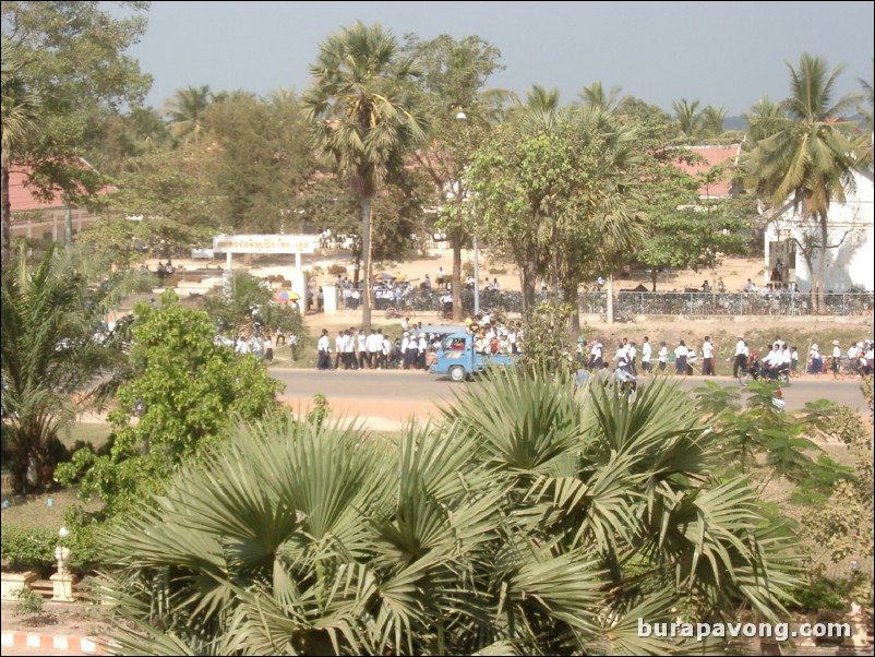 School children lining the streets to greet the king.