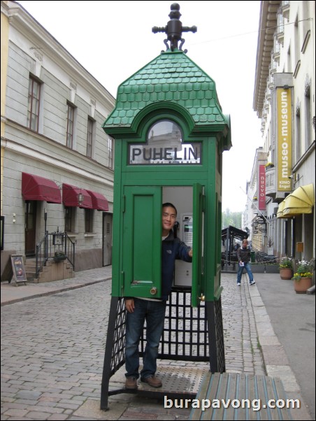 Inside a phone booth.