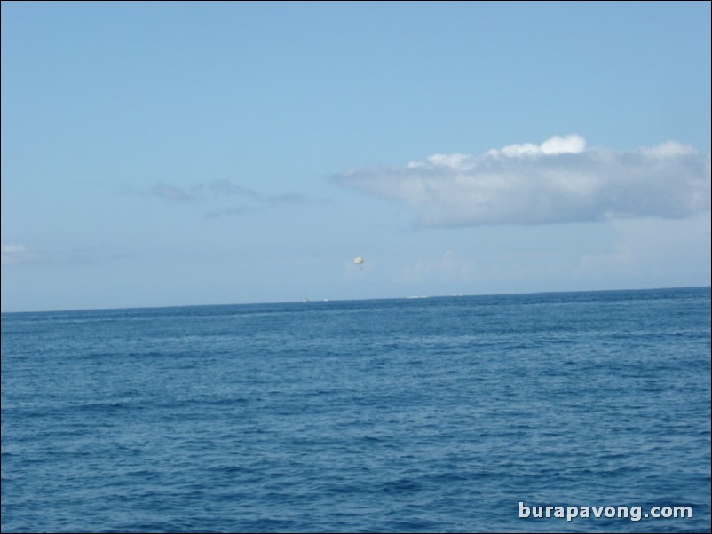 Parasailers in the distance.