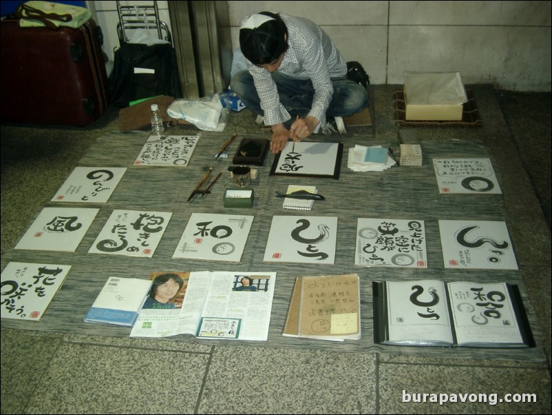 Calligrapher outside Shinjuku station.