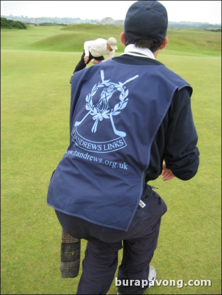 My caddy Oliver helping me read a putt.