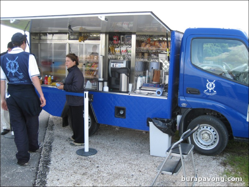 At the turn.  Refreshment truck.