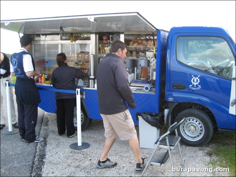 At the turn.  Refreshment truck.