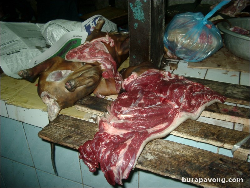 Dogs at a market in Hanoi.