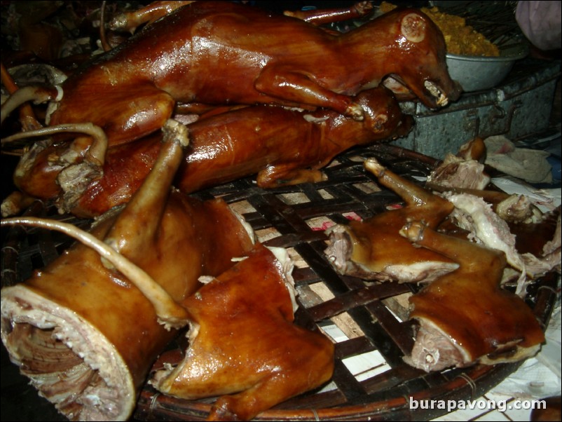 Dogs at a market in Hanoi.