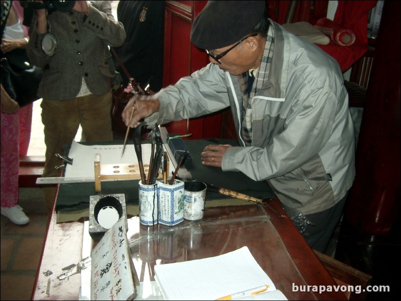 A calligrapher at Hoan Kiem Lake.